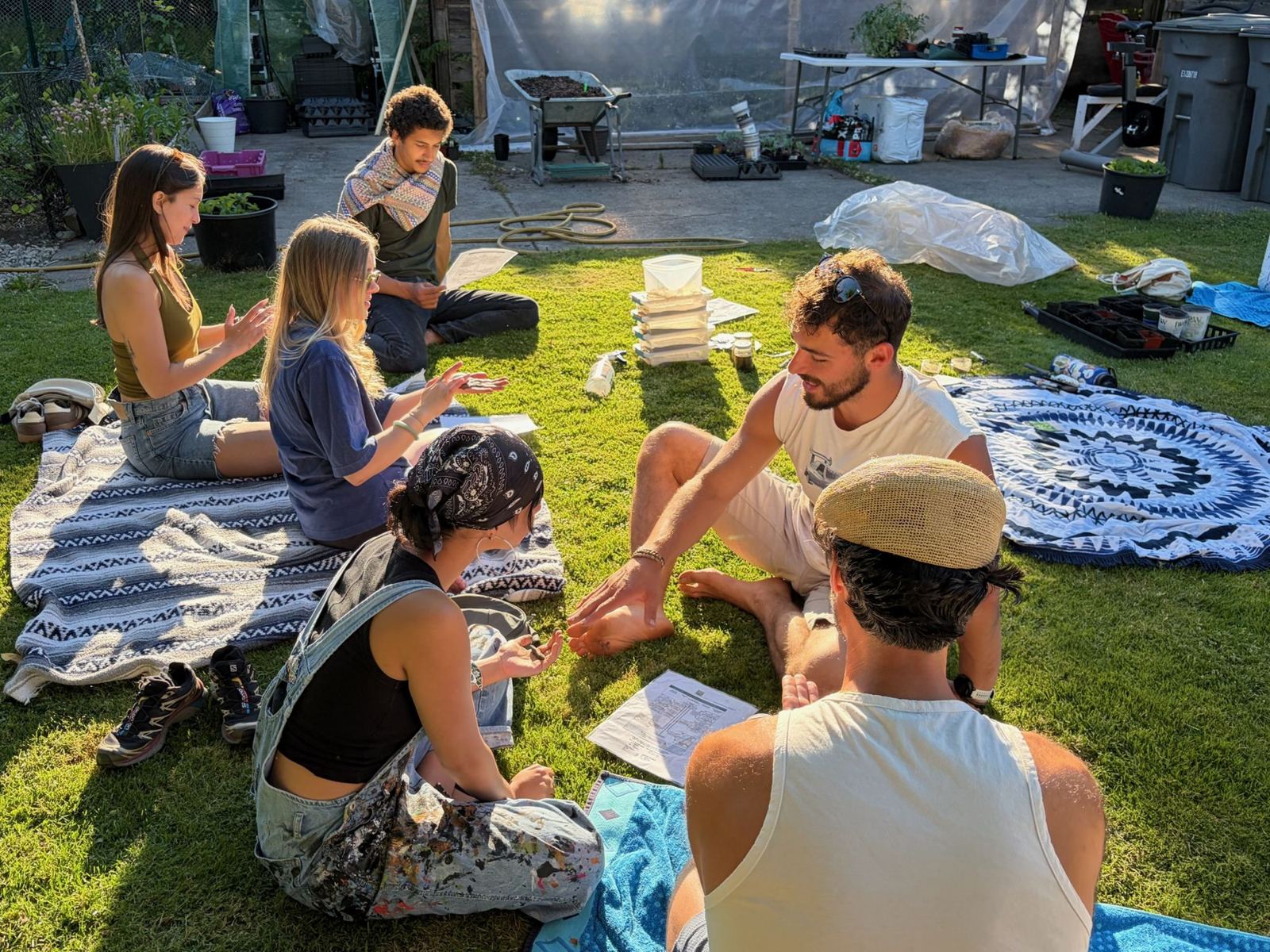 Hands-on workshop moment with people working together on the grass